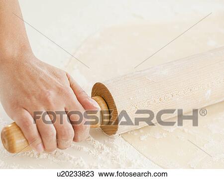 Close up of woman's hand preparing dough with roller pin View Large Photo Image Stock Image - Close up of woman's hand preparing dough with roller pin. Fotosearch