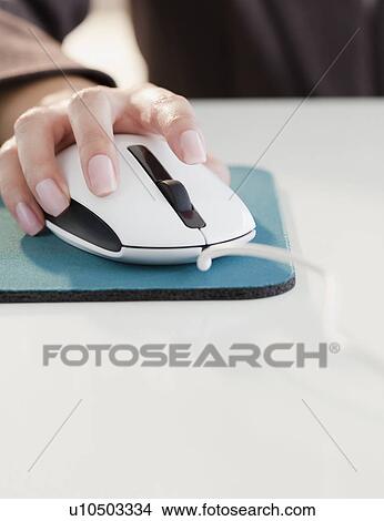 Close up of woman's hand using computer mouse View Large Photo Image Picture - Close up of woman's hand using computer mouse. Fotosearch