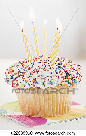 Cupcake with birthday candles View Large Photo Image Stock Image - Cupcake with birthday candles. Fotosearch