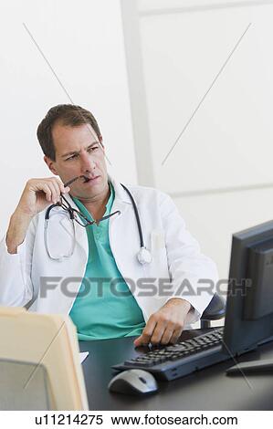Stock Photography - Doctor in office. Fotosearch