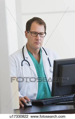 Doctor using computer View Large Photo Image Stock Image - Doctor using computer. Fotosearch