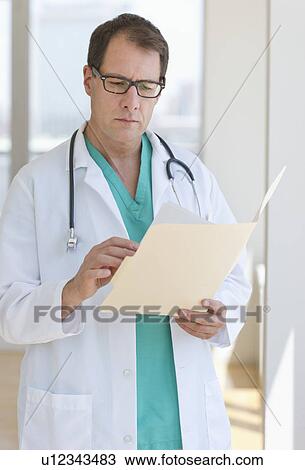 Doctor writing in clipboard View Large Photo Image Stock Image - Doctor writing in clipboard. Fotosearch
