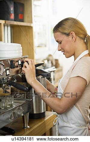Stock Image - Female cafe owner. Fotosearch