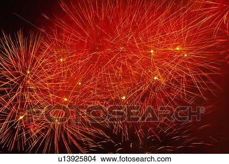 Picture - Fireworks explosion against night sky. Fotosearch