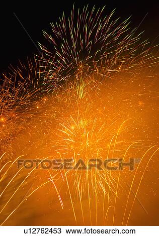 Fireworks explosion against night sky View Large Photo Image Stock Image - Fireworks explosion against night sky. Fotosearch
