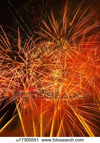 Stock Image - Fireworks explosion against night sky. Fotosearch