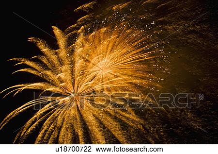 Fireworks explosion against night sky View Large Photo Image Stock Image - Fireworks explosion against night sky. Fotosearch