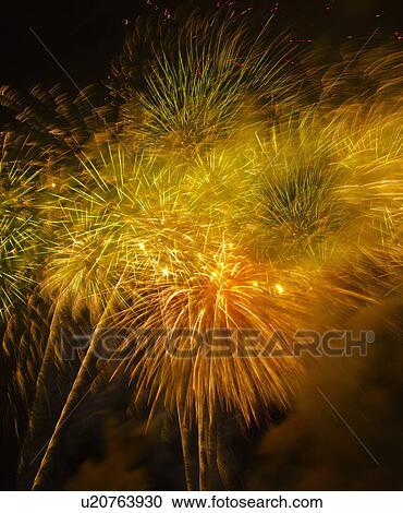 Stock Image - Fireworks explosion against night sky. Fotosearch