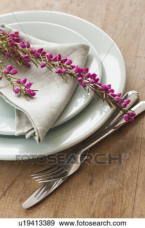 Stock Photo - Flowers on plate with cutlery and napkin. Fotosearch