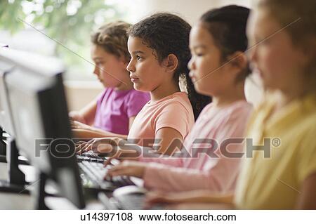 Four girls (6-9) using computers View Large Photo Image Stock Photo - Four girls (6-9) using computers. Fotosearch