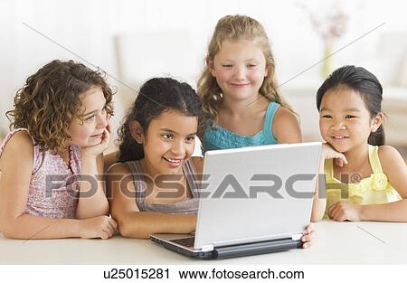 Four girls (6-9) using laptop View Large Photo Image Stock Image - Four girls (6-9) using laptop. Fotosearch