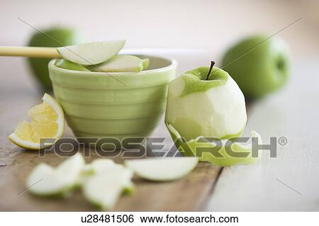Stock Photograph - Fresh apples peeled for baking. Fotosearch