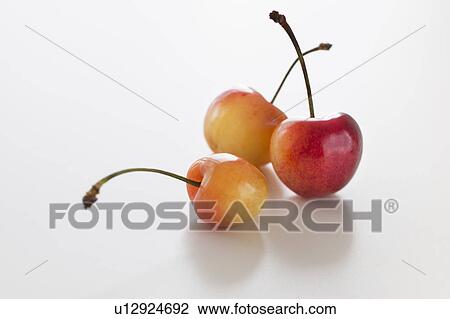 Stock Image - Fresh cherries on white background. Fotosearch