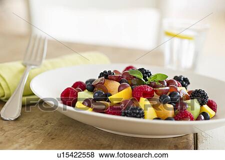 Fresh fruit salad in bowl on table View Large Photo Image Stock Photo - Fresh fruit salad in bowl on table. Fotosearch