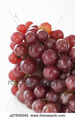 Stock Photography - Fresh red grapes on white background. Fotosearch