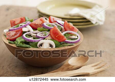 Stock Photography - Fresh salad in bowl on table. Fotosearch