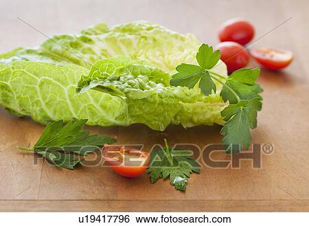 Stock Photograph - Fresh salad on cutting board. Fotosearch