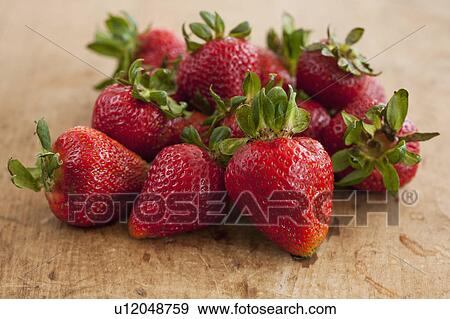 Stock Photo - Fresh strawberries on table. Fotosearch