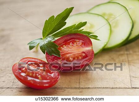 Fresh tomatoes and cucumber with herb View Large Photo Image Stock Photograph - Fresh tomatoes and cucumber with herb. Fotosearch