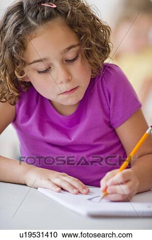 Girl (6-7) taking exam View Large Photo Image Stock Image - Girl (6-7) taking exam. Fotosearch