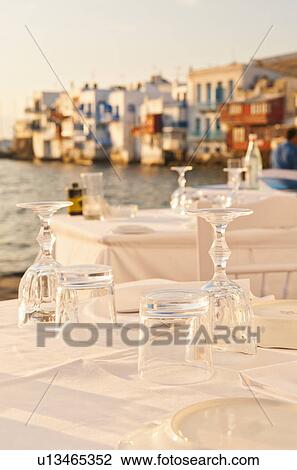 Greece, Cyclades Islands, Mykonos, Set tables by sea View Large Photo Image Stock Image - Greece, Cyclades Islands, Mykonos, Set tables by sea. Fotosearch