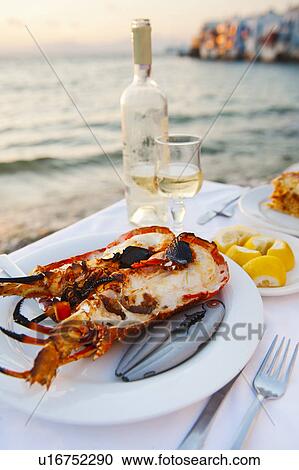 Greece, Cyclades Islands, Mykonos, Lobster dinner at coast View Large Photo Image Stock Image - Greece, Cyclades Islands, Mykonos, Lobster dinner at coast. Fotosearch