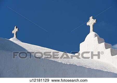 Stock Photo - Greece, Cyclades Islands, Mykonos, Crosses on church roof. Fotosearch