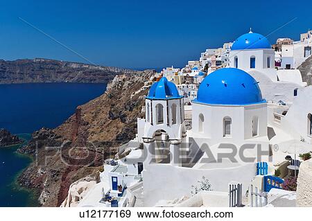 Stock Photo - Greece, Cyclades Islands, Santorini, Oia, Town at coast. Fotosearch