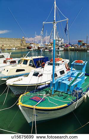 Greece, Rhodes, Harbor and old town wall View Large Photo Image Stock Photo - Greece, Rhodes, Harbor and old town wall. Fotosearch