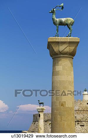 Greece, Rhodes, Mandraki Harbor, Statues on columns View Large Photo Image Stock Photo - Greece, Rhodes, Mandraki Harbor, Statues on columns. Fotosearch