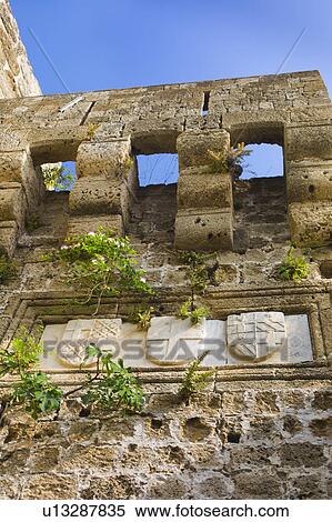 Greece, Rhodes, Medieval fortified wall with stone shields View Large Photo Image Stock Photography - Greece, Rhodes, Medieval fortified wall with stone shields. Fotosearch