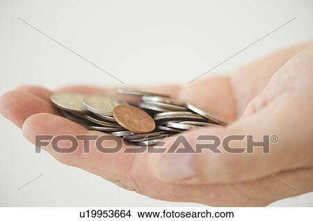 Hand holding coins View Large Photo Image Picture - Hand holding coins. Fotosearch