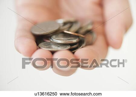 Hand holding coins View Large Photo Image Stock Image - Hand holding coins. Fotosearch