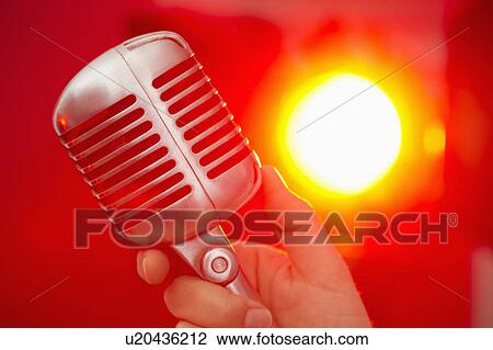 Hand holding microphone View Large Photo Image Stock Image - Hand holding microphone. Fotosearch