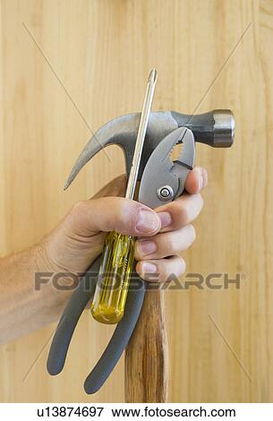 Hand holding tools View Large Photo Image Stock Photo - Hand holding tools. Fotosearch