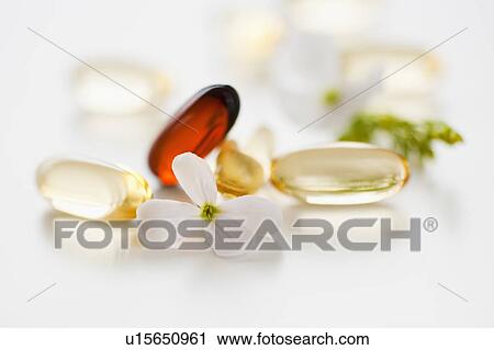 Stock Image - Herbal medicine pills. Fotosearch