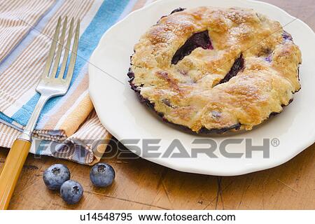 Home made blueberry pie with blueberries View Large Photo Image Stock Photography - Home made blueberry pie with blueberries. Fotosearch