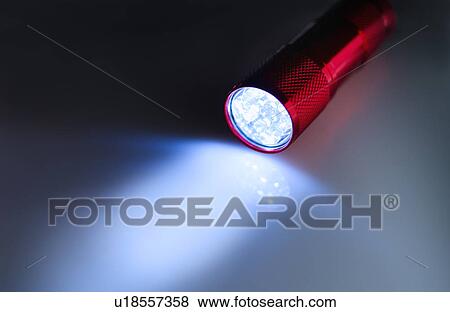 Stock Photo - Illuminated flashlight. Fotosearch