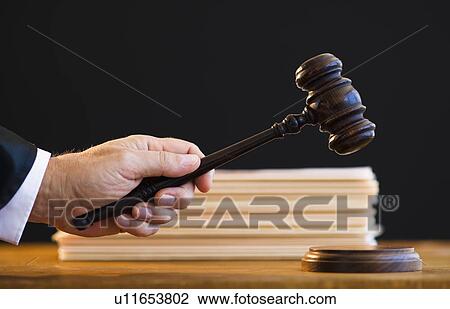 Judge holding gavel, close-up View Large Photo Image Stock Image - Judge holding gavel, close-up. Fotosearch