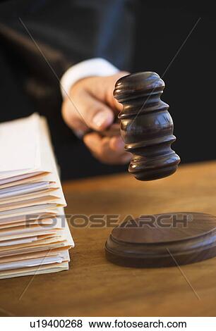 Judge holding gavel, close-up View Large Photo Image Stock Photo - Judge holding gavel, close-up. Fotosearch