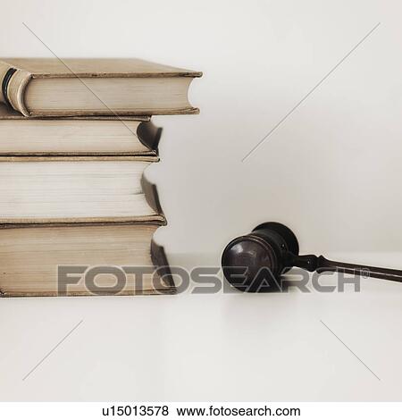 Judges gavel beside stacked law books View Large Photo Image Stock Photo - Judges gavel beside stacked law books. Fotosearch