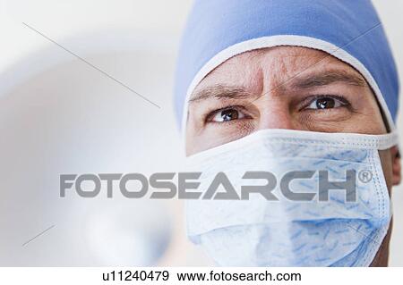 Male surgeon wearing surgical mask View Large Photo Image Stock Photo - Male surgeon wearing surgical mask. Fotosearch