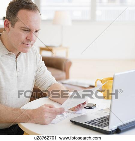 Man doing paperwork View Large Photo Image Stock Image - Man doing paperwork. Fotosearch