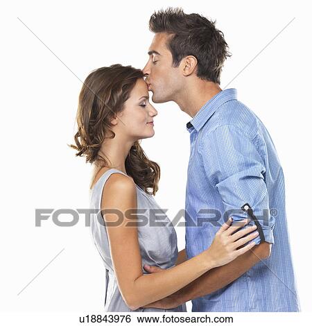 Man kissing woman's forehead View Large Photo Image Stock Photograph - Man kissing woman's forehead. Fotosearch