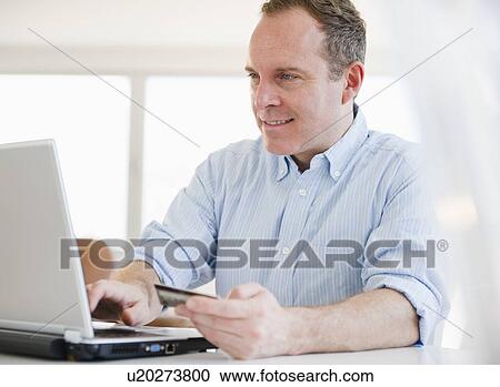 Man shopping via internet View Large Photo Image Stock Image - Man shopping via internet. Fotosearch