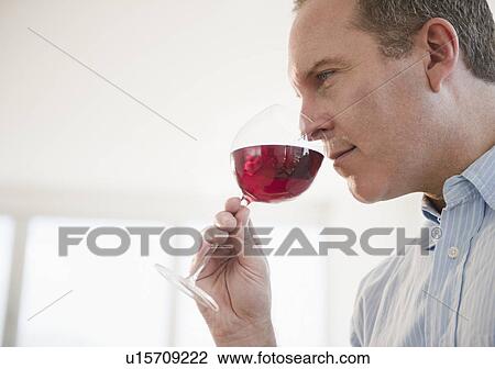 Stock Image - Man tasting wine. Fotosearch