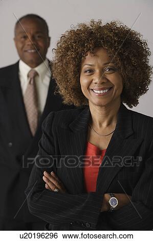 Mature business people, studio shot View Large Photo Image Stock Photograph - Mature business people, studio shot. Fotosearch