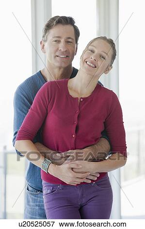 Mature couple in empty living room View Large Photo Image Stock Photo - Mature couple in empty living room. Fotosearch