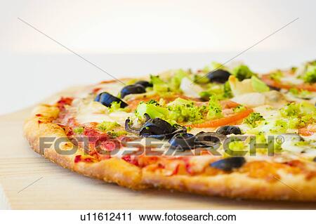 Pizza with vegetable topping View Large Photo Image Stock Image - Pizza with vegetable topping. Fotosearch
