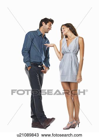 Playful couple smiling and looking at each other View Large Photo Image Stock Image - Playful couple smiling and looking at each other. Fotosearch